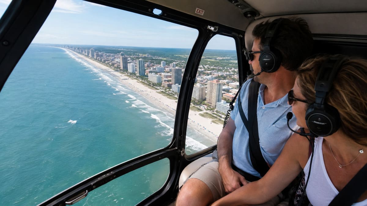 Two tourists enjoying a helicopter tour above the Myrtle Beach coastline.