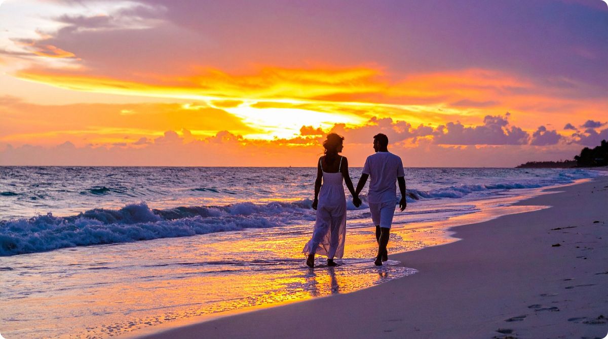 fall vacation couple during a tropical sunset